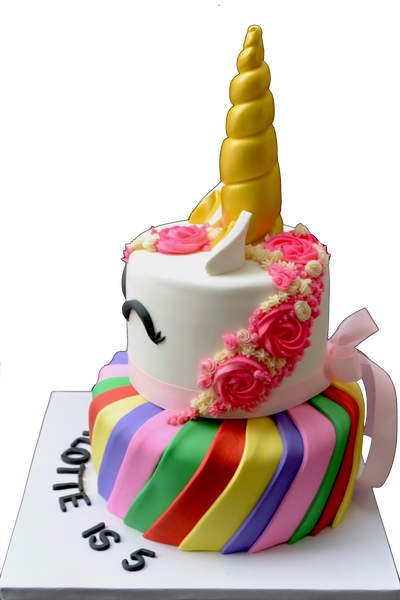 2 tier unicorn cake with rainbow bottom tier with nutella chocolate cake and top tier unicorn pink made of chocolate chip cookie dough cake by Sugar Street Boutique Toronto Cakes