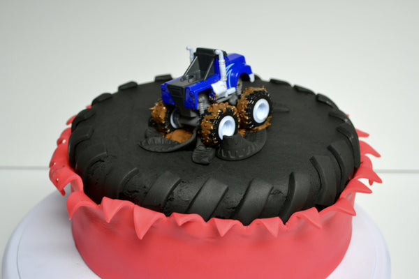 monster truck red velvet cake with a big tire by sugar street boutique toronto