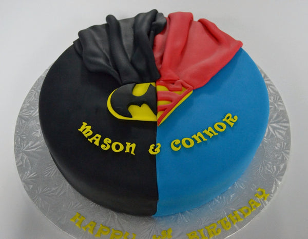 Batman & Superman cake by Sugar Street Boutique. Toronto cake. Lemon cake. lemon superhero cake. batman cake. superman cake. superhero cake. fondant cake. toronto baker. sugar street boutique. superheroes. superheroes cake. cape cake. superman. batman.