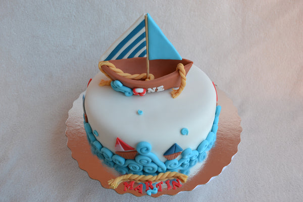 Boat cake by Sugar Street Boutique. Toronto cakes. Chocolate cake. Fondant cake. Boat sweet. Boat cake. sailor cake. one birthday cake.  fondant boat. fondant sailor. boat cake toronto. sugar street boutique. designer cake. boat.
