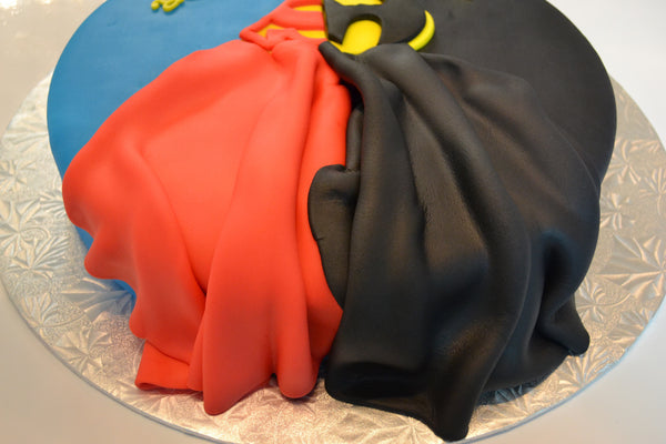 Batman & Superman cake by Sugar Street Boutique. Toronto cake. Lemon cake. lemon superhero cake. batman cake. superman cake. superhero cake. fondant cake. toronto baker. sugar street boutique. superheroes. superheroes cake. cape cake. superman. batman.
