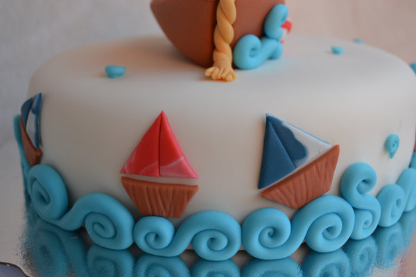 Boat cake by Sugar Street Boutique. Toronto cakes. Chocolate cake. Fondant cake. Boat sweet. Boat cake. sailor cake. one birthday cake.  fondant boat. fondant sailor. boat cake toronto. sugar street boutique. designer cake. boat.