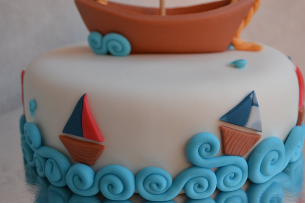 Boat cake by Sugar Street Boutique. Toronto cakes. Chocolate cake. Fondant cake. Boat sweet. Boat cake. sailor cake. one birthday cake.  fondant boat. fondant sailor. boat cake toronto. sugar street boutique. designer cake. boat.