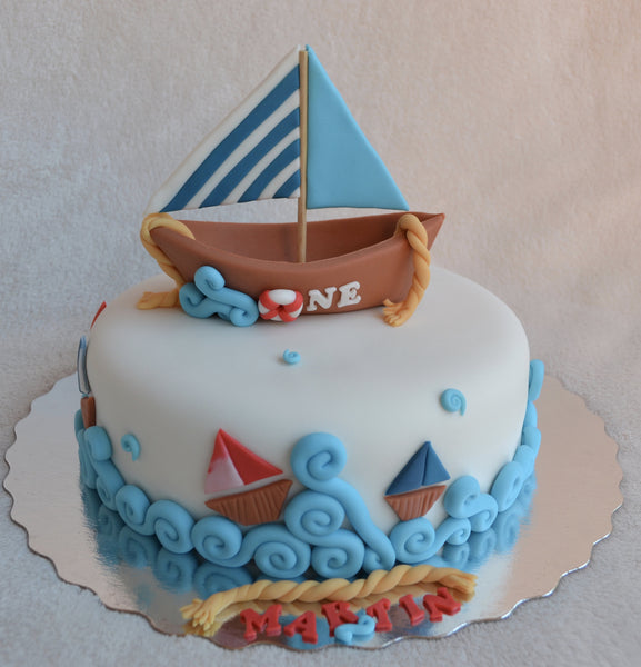 Boat cake by Sugar Street Boutique. Toronto cakes. Chocolate cake. Fondant cake. Boat sweet. Boat cake. sailor cake. one birthday cake.  fondant boat. fondant sailor. boat cake toronto. sugar street boutique. designer cake. boat.