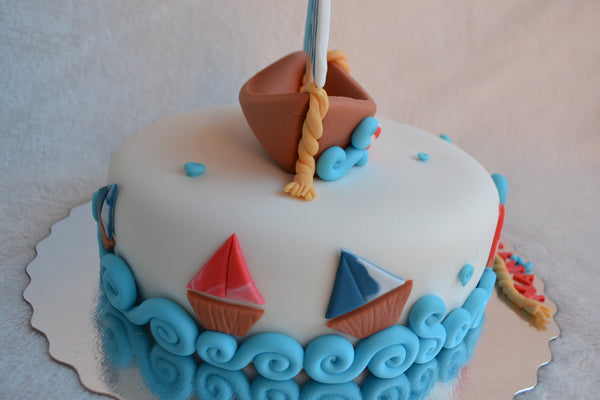 Boat cake by Sugar Street Boutique. Toronto cakes. Chocolate cake. Fondant cake. Boat sweet. Boat cake. sailor cake. one birthday cake.  fondant boat. fondant sailor. boat cake toronto. sugar street boutique. designer cake. boat.