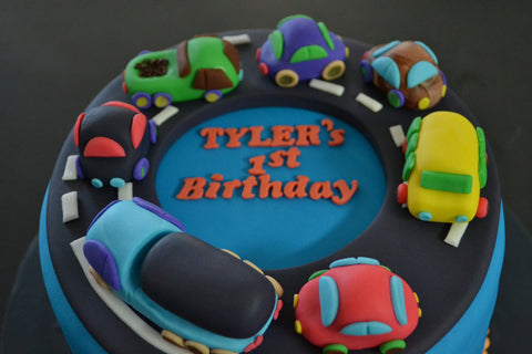 Cars & Trucks cake by Sugar Street Boutique Toronto. toronto cakes. cars cake. cars cake toronto. truck cake. truck cake toronto. cars and trucks cake. cars and trucks cake toronto. fondant cars. blue cake. vanilla fondant cake. cars and trucks. 1st birthday cake. first birthday cake. designer cake.sugar street boutique. cars and truck party.  cars party. trucks party. birthday cars. birthday cars cake.