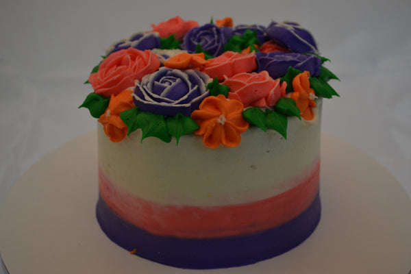 icing flower cake by sugar street boutique. sugar street boutique. icing flower cake. icing flower cake toronto. toronto cakes. lemon cake. lemon curd filling. lemon cream cheese icing. lemon flowers. cream cheese flowers. flowers cake. flowers cake toronto. designer cake. purple flowers cake. orange flowers cake. red flowers cake. colourful flower cake.