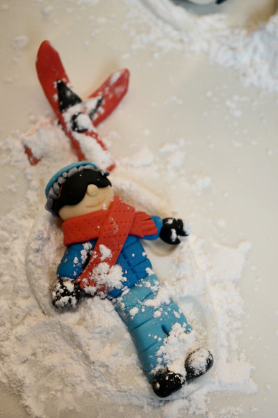 ski cake by Sugar Street Boutique. Sugar Street Boutique Toronto. Ski cake. snow cake. slope ski cake. skier cake. gondola cake. cabin cake. slope cake. red velvet cake. designer cake. ski cake toronto. 