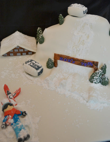 ski cake by Sugar Street Boutique. Sugar Street Boutique Toronto. Ski cake. snow cake. slope ski cake. skier cake. gondola cake. cabin cake. slope cake. red velvet cake. designer cake. ski cake toronto. 