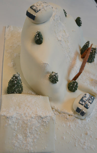 ski cake by Sugar Street Boutique. Sugar Street Boutique Toronto. Ski cake. snow cake. slope ski cake. skier cake. gondola cake. cabin cake. slope cake. red velvet cake. designer cake. ski cake toronto. 