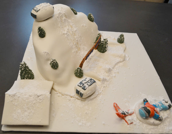 ski cake by Sugar Street Boutique. Sugar Street Boutique Toronto. Ski cake. snow cake. slope ski cake. skier cake. gondola cake. cabin cake. slope cake. red velvet cake. designer cake. ski cake toronto. 