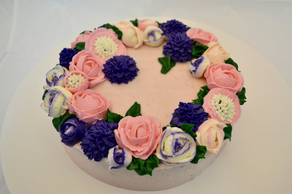 icing flower cake by sugar street boutique. sugar street boutique. icing flower cake. icing flower cake toronto. toronto cakes. lemon cake. lemon curd filling. lemon cream cheese icing. lemon flowers. cream cheese flowers. flowers cake. flowers cake toronto. designer cake. purple flowers cake.  colourful flower cake. light pink flowers icing. pink and purple icing flowers. piping flowers.  icing flowers cake toronto.