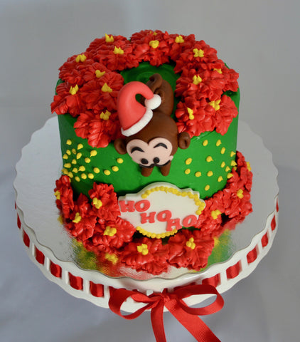 Poinsettia chocolate christmas cake by Sugar Street Boutique in Toronto. Chocolate Holiday Cake decorated with cream cheese icing.