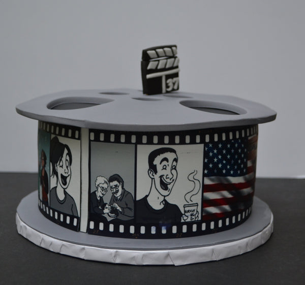 This Vanilla Movie Reel Cake was 100% edible. Decorated with edible images and fondant by Sugar Street Boutique Toronto