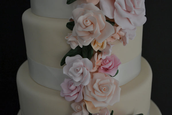 5 Tier Wedding Floral drapping Cake with soft pink and peach colors made by Sugar Street Boutique Toronto