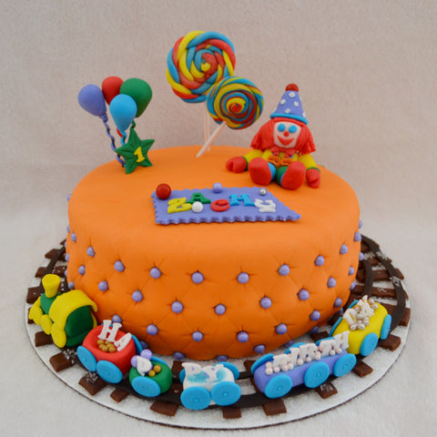 Gymboree Cake by Sugar Street Boutique Toronto Ontario Canada Gymbo the Clown Gymboree Play & Learn Chocolate Cake HappyCake Circus Cake Train Cake Fondant Masterpiece Colourful Cake Balloons Lollipops Luxury Cakes