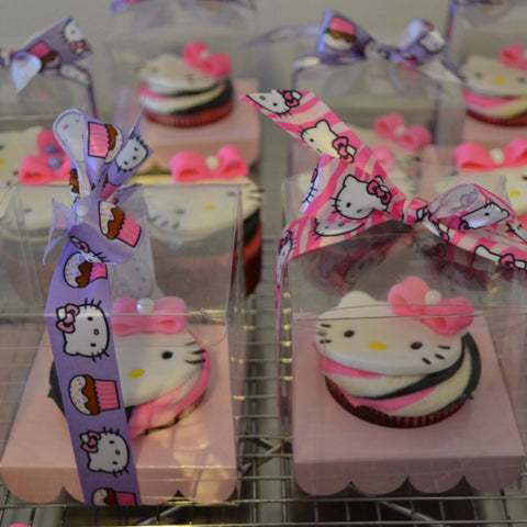 Hello Kitty Cupcakes by Sugar Street Boutique Toronto Ontario Canada Vanilla Cake HappyCake Fondant Masterpiece Colourful CupCake Luxury CupCakes Kitty Cake Cupcake in a box Hello Kitty Ribbon Boxed Cupcake TriColour Swirl Birthday Giveaways