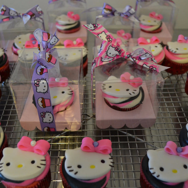 Hello Kitty Cupcakes by Sugar Street Boutique Toronto Ontario Canada Vanilla Cake HappyCake Fondant Masterpiece Colourful CupCake Luxury CupCakes Kitty Cake Cupcake in a box Hello Kitty Ribbon Boxed Cupcake TriColour Swirl Birthday Giveaways