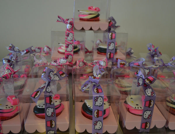 Hello Kitty Cupcakes by Sugar Street Boutique Toronto Ontario Canada Vanilla Cake HappyCake Fondant Masterpiece Colourful CupCake Luxury CupCakes Kitty Cake Cupcake in a box Hello Kitty Ribbon Boxed Cupcake TriColour Swirl Birthday Giveaways