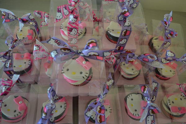 Hello Kitty Cupcakes by Sugar Street Boutique Toronto Ontario Canada Vanilla Cake HappyCake Fondant Masterpiece Colourful CupCake Luxury CupCakes Kitty Cake Cupcake in a box Hello Kitty Ribbon Boxed Cupcake TriColour Swirl Birthday Giveaways