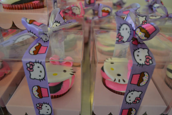 Hello Kitty Cupcakes by Sugar Street Boutique Toronto Ontario Canada Vanilla Cake HappyCake Fondant Masterpiece Colourful CupCake Luxury CupCakes Kitty Cake Cupcake in a box Hello Kitty Ribbon Boxed Cupcake TriColour Swirl Birthday Giveaways