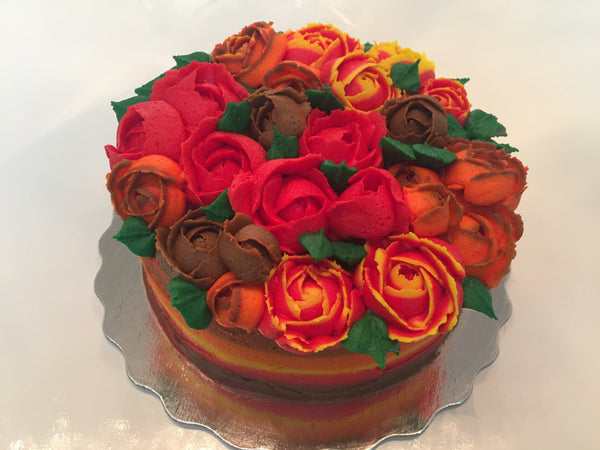 icing flower cake by sugar street boutique. sugar street boutique. icing flower cake. icing flower cake toronto. toronto cakes. lemon cake. lemon curd filling. lemon cream cheese icing. lemon flowers. cream cheese flowers. flowers cake. flowers cake toronto. designer cake. purple flowers cake. orange flowers cake. red flowers cake. colourful flower cake. fall colours cake. fall colors cake. fall cake. fall icing roses. thanksgiving cake. multicoloured icing roses. piped roses.