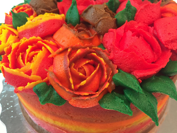 icing flower cake by sugar street boutique. sugar street boutique. icing flower cake. icing flower cake toronto. toronto cakes. lemon cake. lemon curd filling. lemon cream cheese icing. lemon flowers. cream cheese flowers. flowers cake. flowers cake toronto. designer cake. purple flowers cake. orange flowers cake. red flowers cake. colourful flower cake. fall colours cake. fall colors cake. fall cake. fall icing roses. thanksgiving cake. multicoloured icing roses. piped roses.