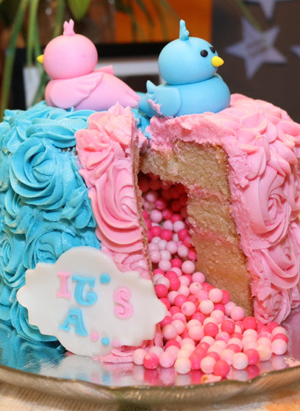 Gender reveal cake by Sugar Street Boutique Toronto. Toronto cake. Toronto cakes. gender reveal. gender reveal cake. pink or blue cake. boy or girl cake. bird cake. rosette cake. pink and blue rosettes. lemon cream cheese. lemon cake. designer cake. 