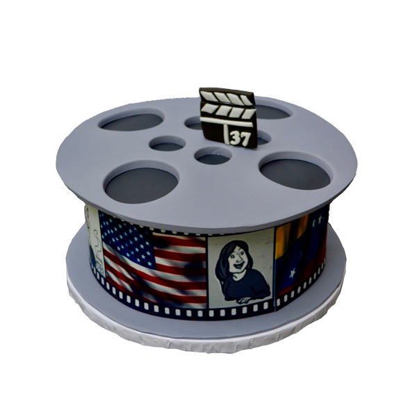 This Vanilla Movie Reel Cake was 100% edible. Decorated with edible images and fondant by Sugar Street Boutique Toronto