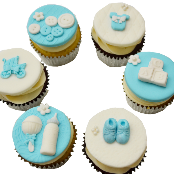 blue and white baby shower cupcakes toronto by sugar street boutique with fondant baby booties, fondant baby rattle,  fondant baby bottle, fondant buttons, fondant onesie, fondant baby cubes & fondant stroller