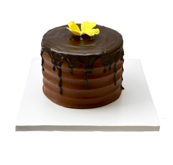 Chocolate drip cake decorated with an edible yellow flower by sugar street boutique, toronto cakes