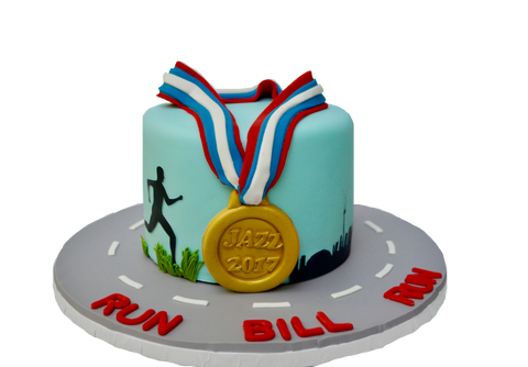 jazz run toronto marathon 2017 cake with a gold medal, the toronto skyline and a running man, run bill run. Vanilla cake with chocolate icing by sugar street boutique toronto.