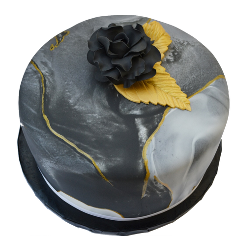 Black marble lemon cake with gold accents and an edible black rose, filled with lemon curd and a light lemon icing in between layers. Sugar Street Boutique toronto cakes.
