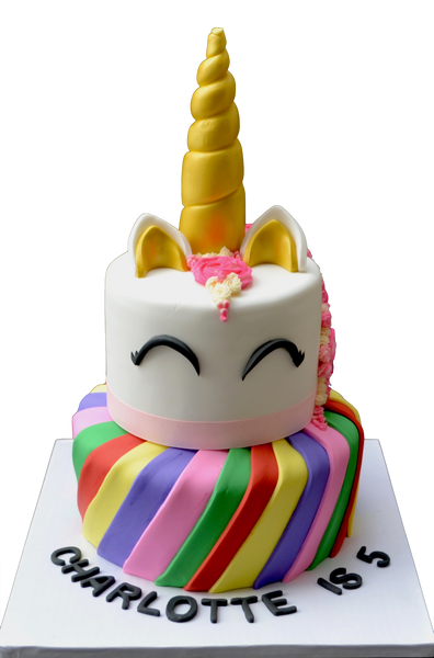 2 tier unicorn cake with rainbow bottom tier with nutella chocolate cake and top tier unicorn pink made of chocolate chip cookie dough cake by Sugar Street Boutique Toronto Cakes. colourful cake