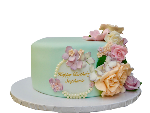 soft teal chocolate cake covered in fondant with edible flowers for a birthday by Sugar Street Boutique Toronto