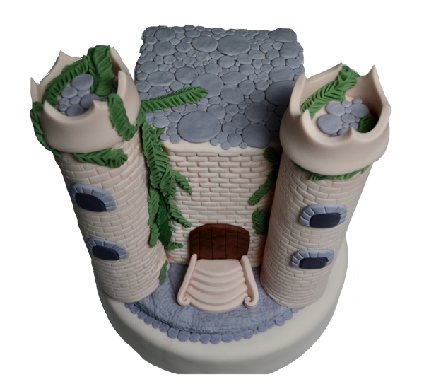 castle cake made of vanilla and fondant decorated with fondant rocks, fondant bricks, fondant castle perfect for a queen castle or king castle by sugar street boutique toronto