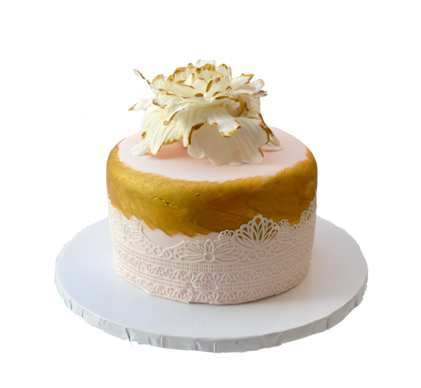 Chocolate Cake decorated with edible lace and flower finished with edible gold accents by sugar street boutique toronto