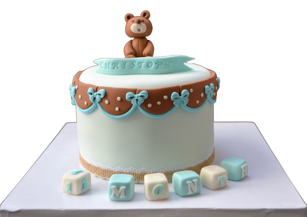 light blue cake with a fondant edible bear to celebrate a baby's first month. 100 days cake. sugar street boutique. toronto cakes. edible blocks.