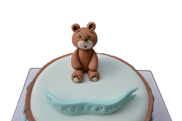 light blue cake with a fondant edible bear to celebrate a baby's first month. 100 days cake. sugar street boutique. toronto cakes. edible blocks.