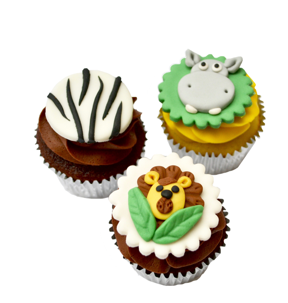 zebra into the cake cake, with animal cupcakes for a safari themed birthday sweets, cupcakes and cake with a lion cupcake, elephant cupcake, tiger cupcake, hippo cupcake by Sugar Street Boutique, toronto cakes