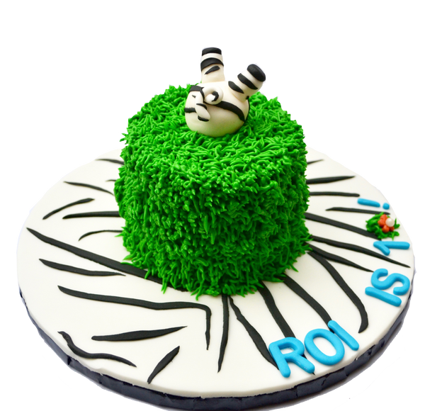 zebra into the cake cake, with animal cupcakes for a safari themed birthday sweets, cupcakes and cake with a lion cupcake, elephant cupcake, tiger cupcake, hippo cupcake by Sugar Street Boutique, toronto cakes