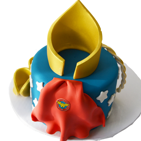 wonder woman chocolate cake with fondant gold crown, fondant rope and fondant wonder woman bracelets with edible red cape by Sugar Street Boutique, Toronto Cakes.
