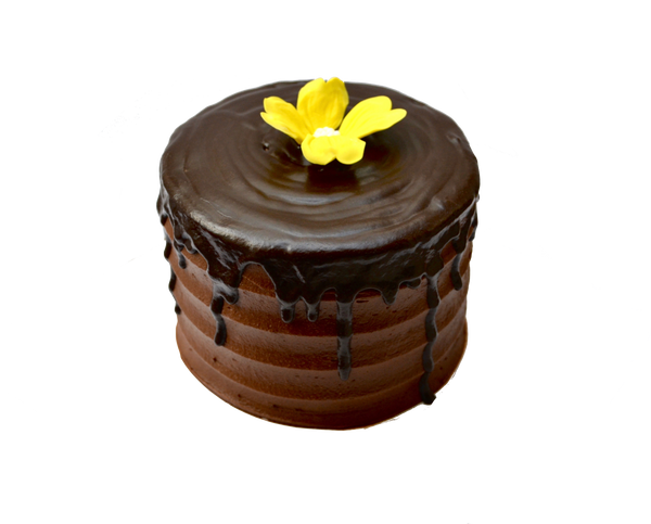 Chocolate drip cake decorated with an edible yellow flower by sugar street boutique, toronto cakes