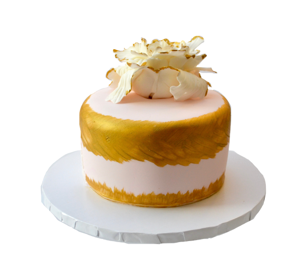 Chocolate Cake decorated with edible lace and flower finished with edible gold accents by sugar street boutique toronto