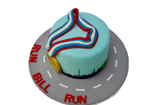 jazz run toronto marathon 2017 cake with a gold medal, the toronto skyline and a running man, run bill run. Vanilla cake with chocolate icing by sugar street boutique toronto.