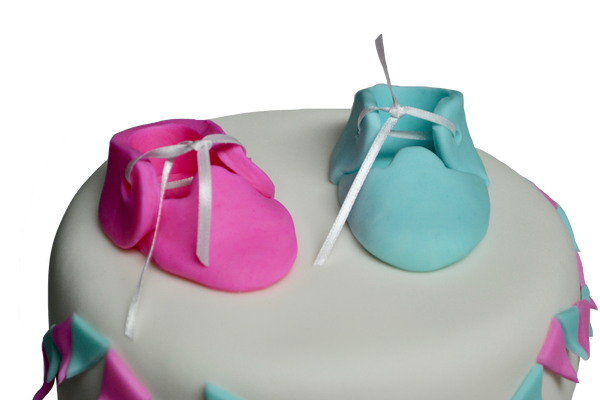 2 tier gender reveal cake with baby booties. is it a boy or a girl cake? Sugar Street Boutique, Toronto