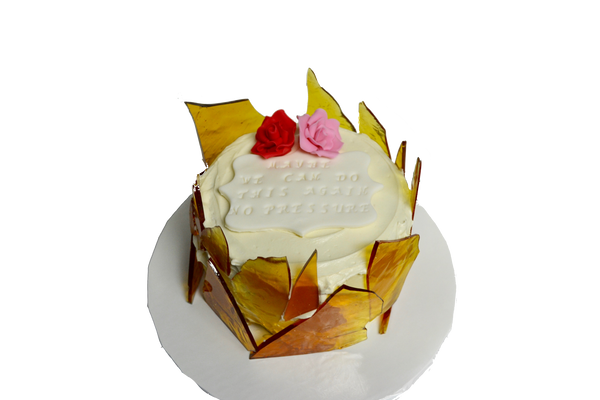 creme brûlée cake with sugar shards and edible pink and red roses with personalized note for valentines day by sugar street boutique, toronto.