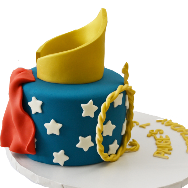 wonder woman chocolate cake with fondant gold crown, fondant rope and fondant wonder woman bracelets with edible red cape by Sugar Street Boutique, Toronto Cakes.