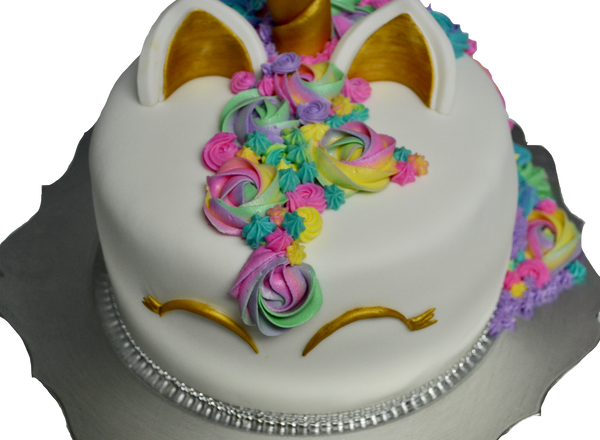 Unicorn chocolate cake covered with fondant and decorated with icing flowers rosettes by sugar street boutique, toronto