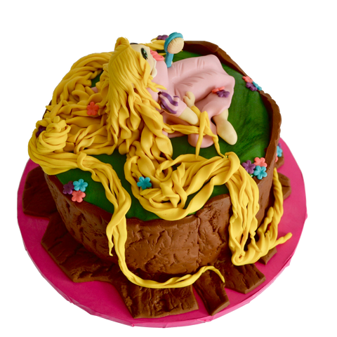 rapunzel chocolate birthday cake with edible rapunzel and long edible hair and tree log for a rapunzel themed birthday by sugar street boutique, Toronto.